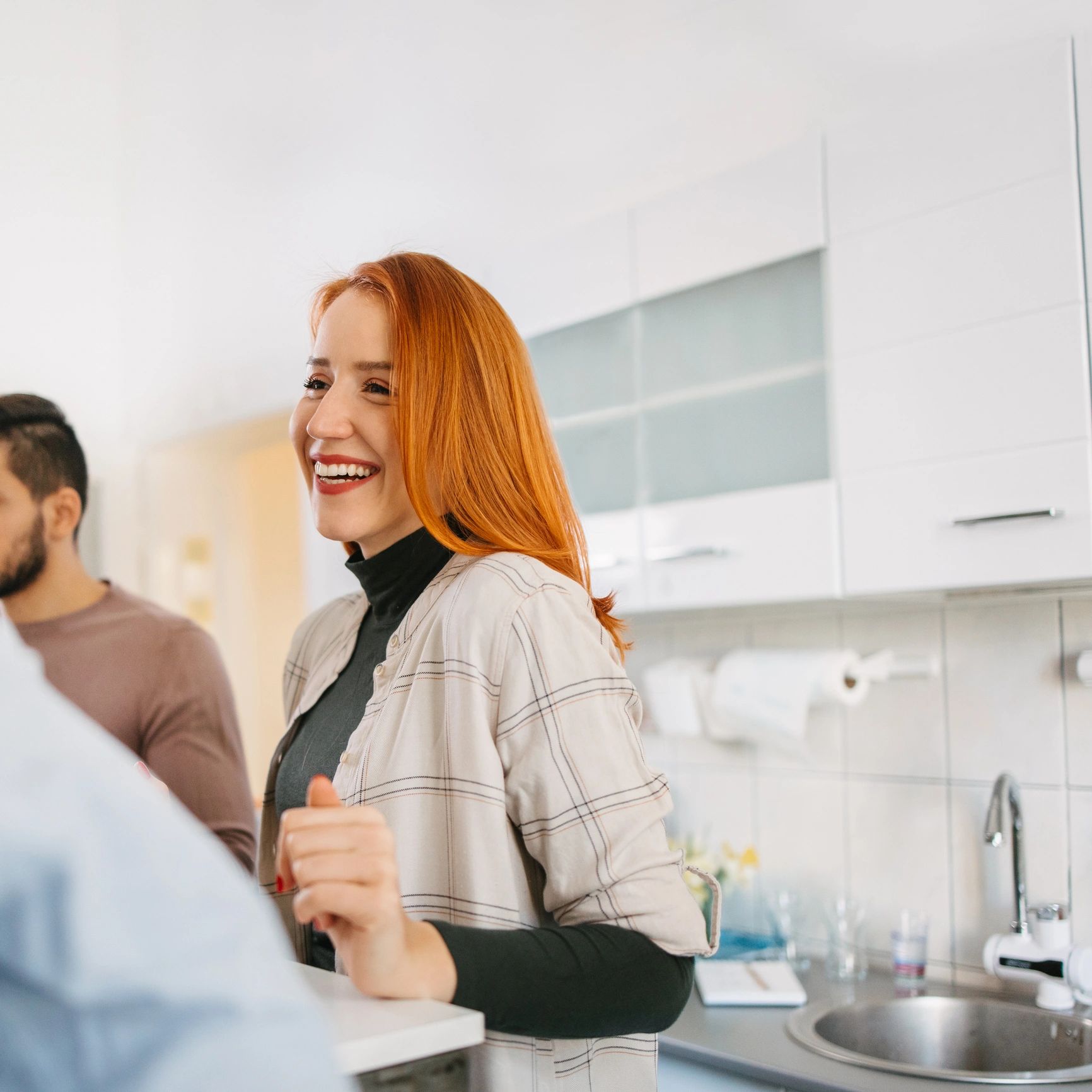 Smiling homeowner in a kitchen