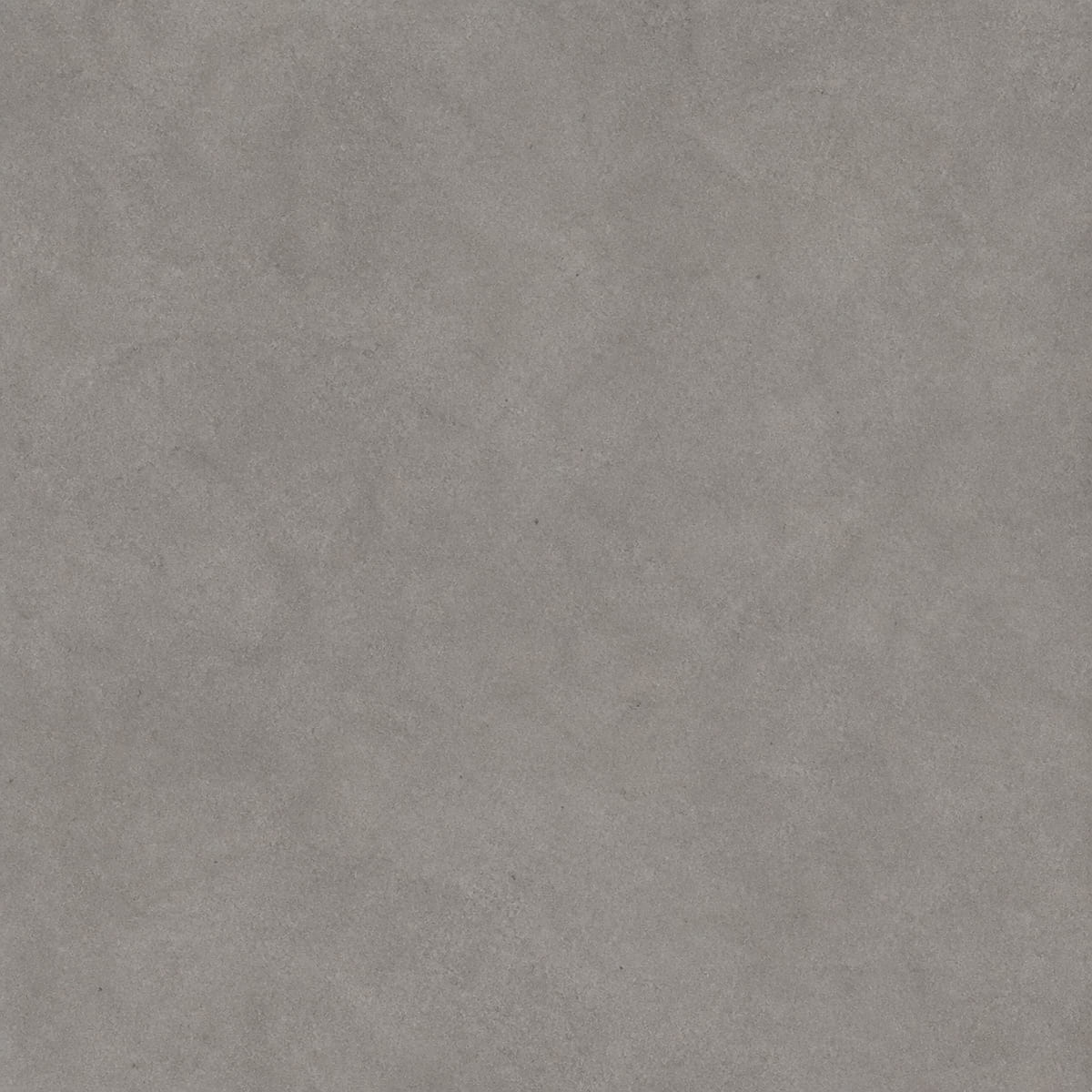 Close-up of a matte mid-grey porcelain countertop with a poured-concrete mottled appearance