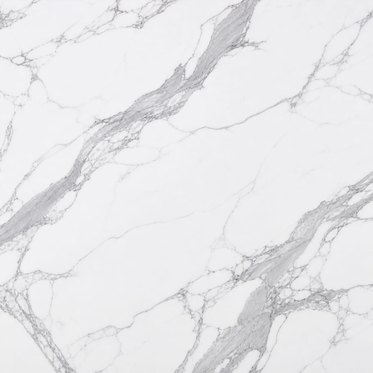 Close-up of a matte white porcelain countertop with bold grey marble-look veining