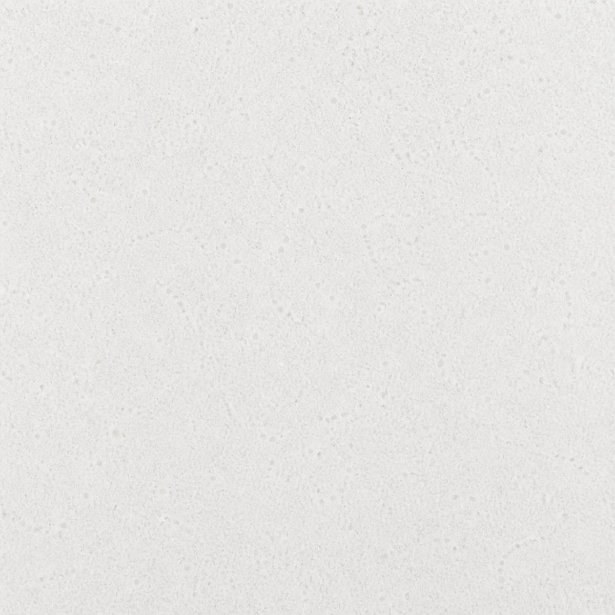 Close-up of a polished pure white quartz countertop surface with no veining, showing a fine even speckle of translucent quartz grains