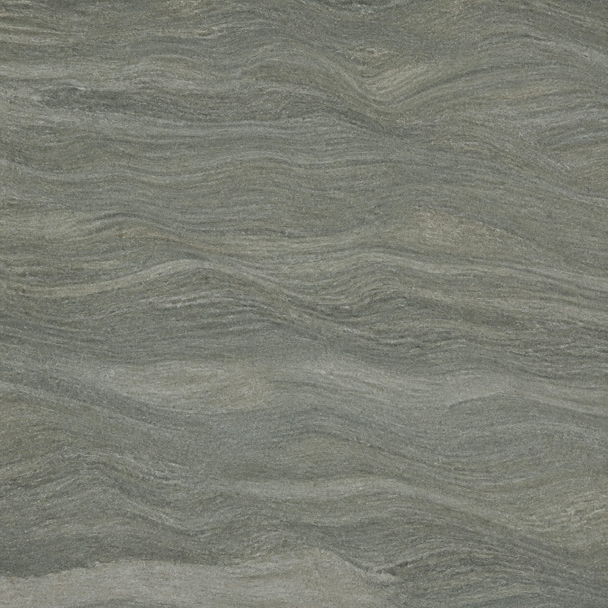 Close-up of a leathered grey-green Sea Pearl quartzite countertop with rippled wavy banding