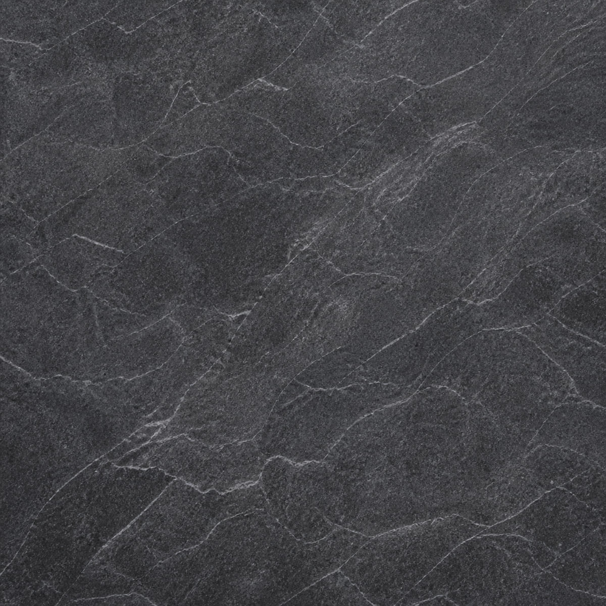 Close-up of a honed Barroca soapstone countertop, deep charcoal with fine wispy white veining