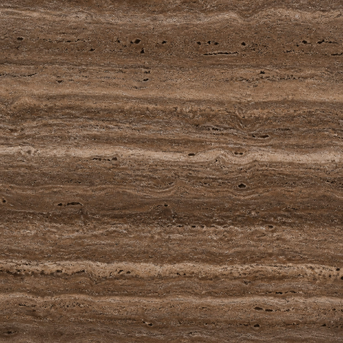 Close-up of a honed Noce travertine surface, rich walnut brown with darker chocolate and lighter tan banding