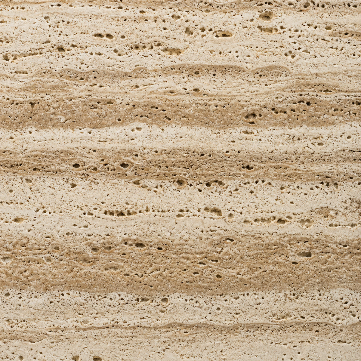 Close-up of a brushed unfilled Scabas travertine surface, cream and tan banded with numerous open pits