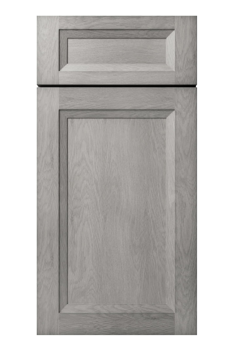 US Cabinet Depot Oxford Mist cabinet door — a grey-taupe finish over birch with the wood grain showing through a brushed glaze